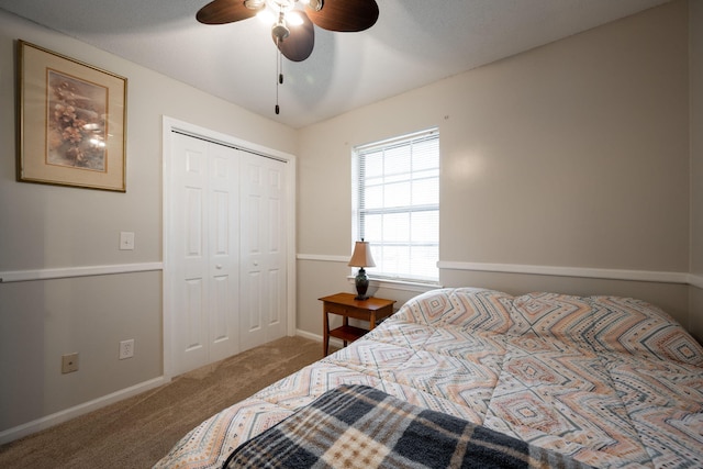 bedroom featuring carpet floors, a closet, and ceiling fan