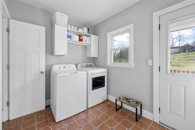 laundry room featuring cabinets and separate washer and dryer