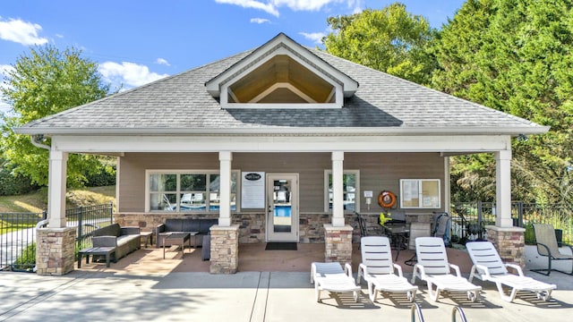 back of house with outdoor lounge area