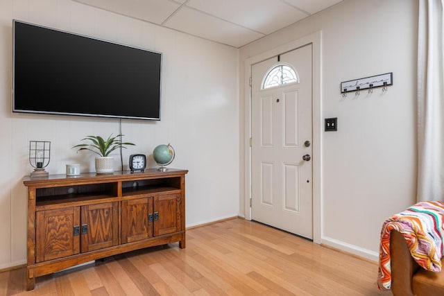 foyer featuring a drop ceiling and light wood-type flooring