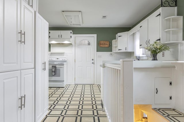 kitchen with white cabinets and stove