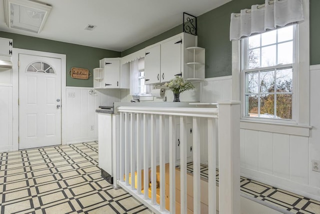 kitchen featuring white cabinets