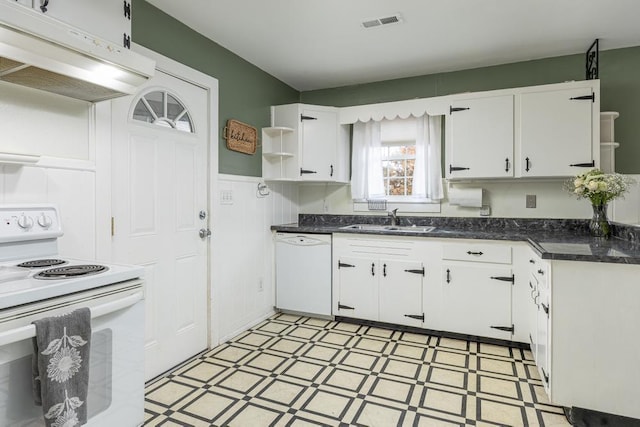 kitchen featuring white appliances, white cabinetry, and sink