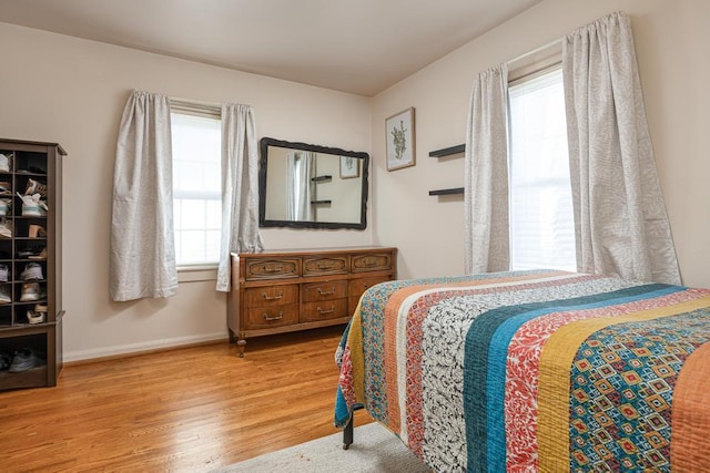 bedroom with hardwood / wood-style flooring