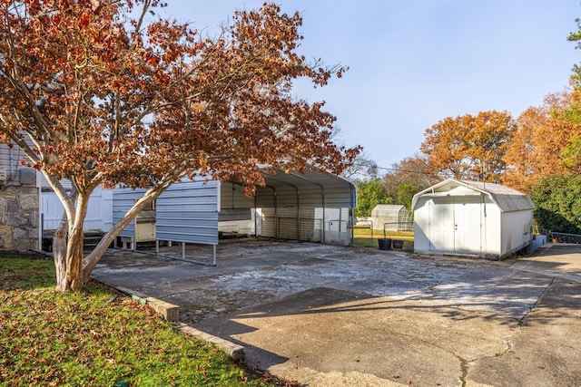 view of outbuilding with a carport