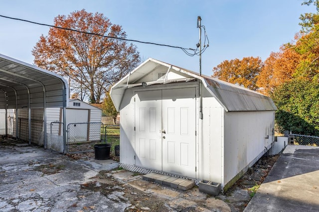 view of outdoor structure with a carport