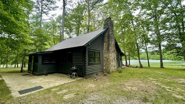 view of side of home featuring a water view