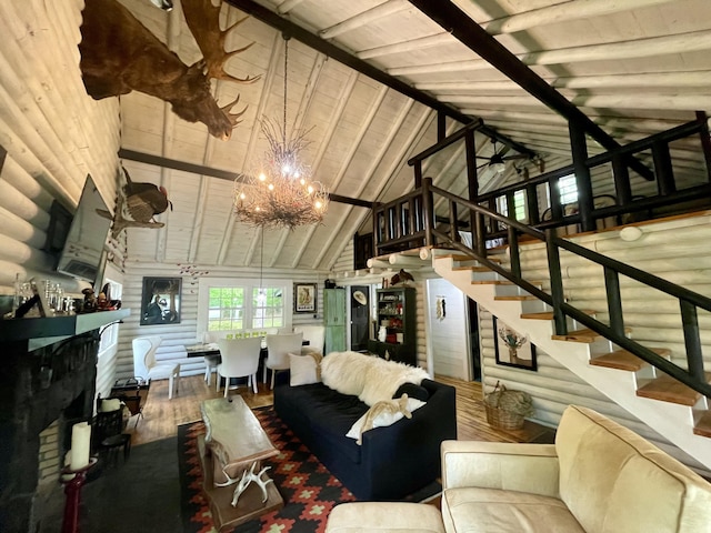 living room with beamed ceiling, a notable chandelier, wood-type flooring, and log walls