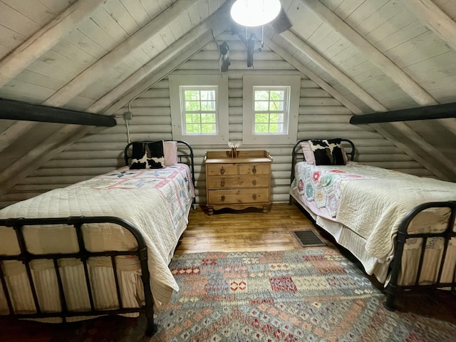 bedroom featuring dark hardwood / wood-style flooring, wooden ceiling, rustic walls, and vaulted ceiling