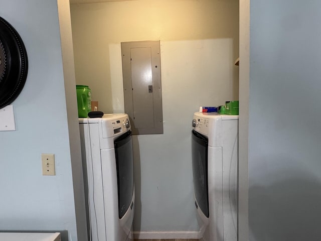 clothes washing area featuring washing machine and clothes dryer and electric panel