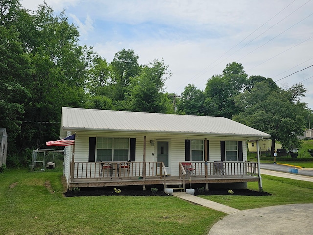 1896 Old Washington Hwy, Dayton, TN 37321 - view of front of house with a porch, a front lawn, and metal roof