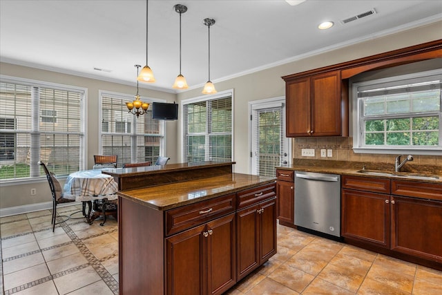 kitchen with stainless steel dishwasher, sink, pendant lighting, a chandelier, and a center island