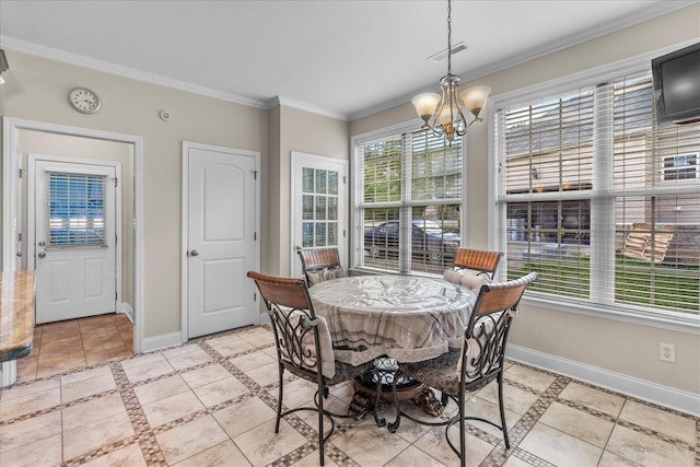 dining room with a chandelier and ornamental molding