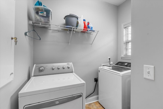 laundry area with independent washer and dryer