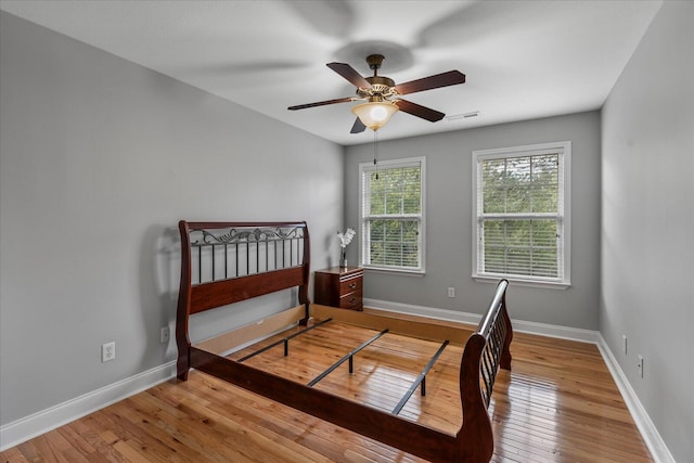 bedroom featuring light wood-type flooring and ceiling fan