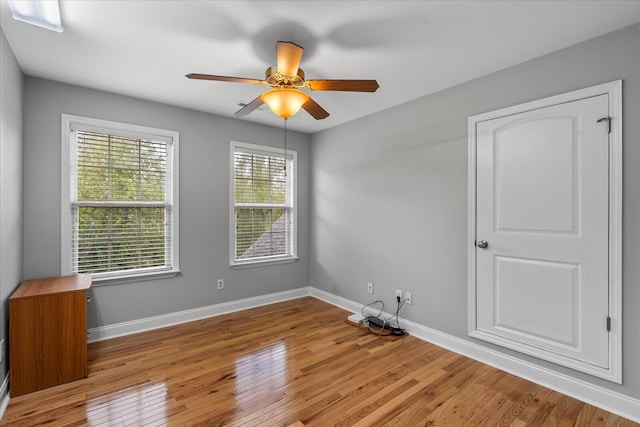 unfurnished room with ceiling fan and light hardwood / wood-style flooring