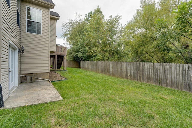 view of yard with a wooden deck