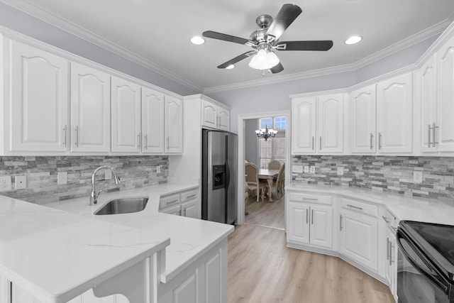 kitchen featuring light stone countertops, black range with electric cooktop, crown molding, stainless steel fridge with ice dispenser, and white cabinetry