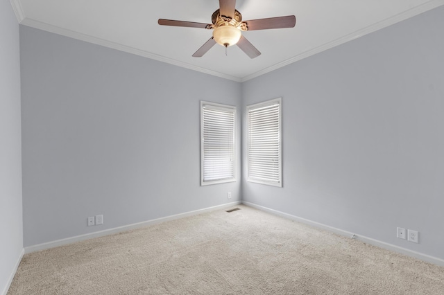 unfurnished room featuring light carpet, ceiling fan, and ornamental molding