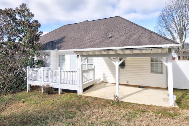 back of property with a patio area and a deck