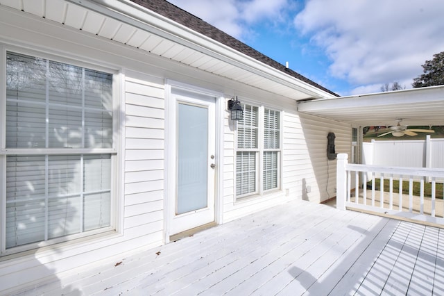 wooden terrace featuring ceiling fan