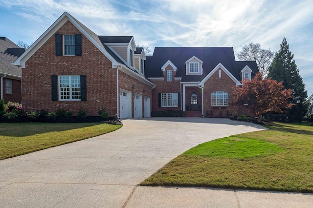 view of front of home featuring a garage and a front yard