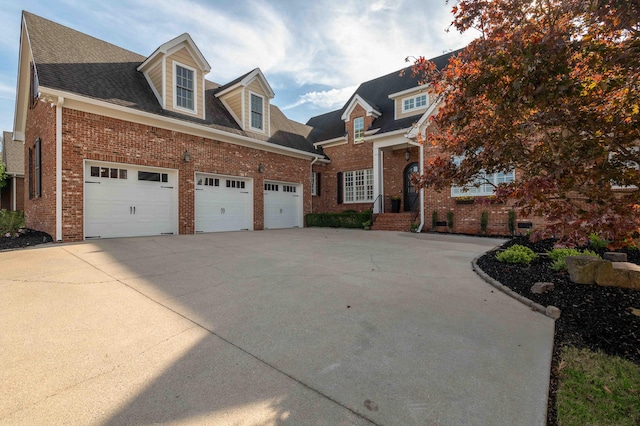 new england style home with a garage