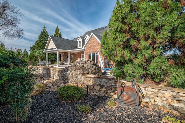 back of house featuring a patio area