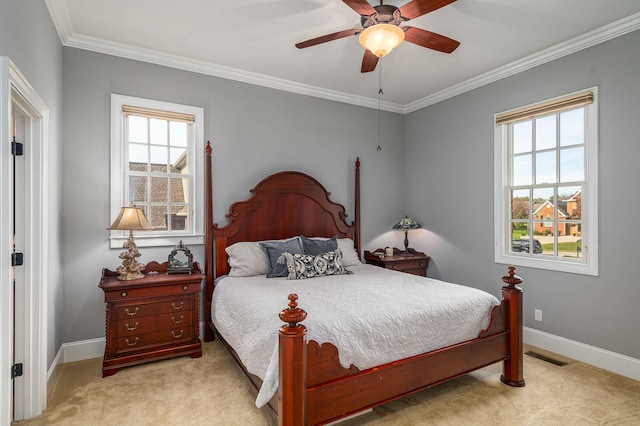 carpeted bedroom featuring ceiling fan and ornamental molding