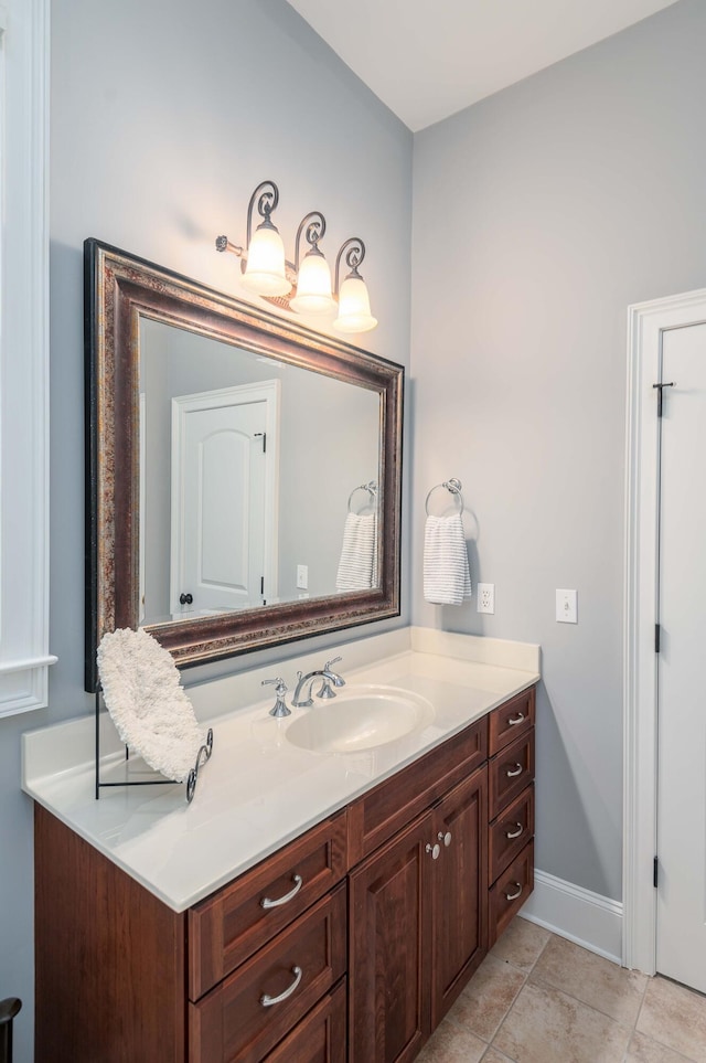 bathroom featuring tile patterned flooring and vanity