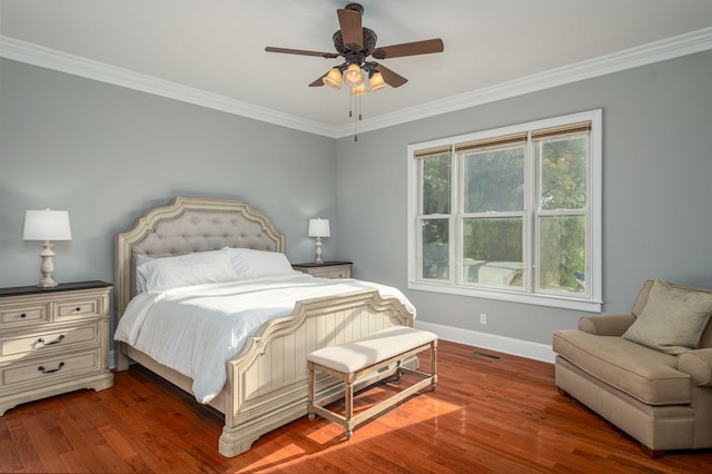 bedroom featuring ceiling fan, dark hardwood / wood-style floors, and ornamental molding