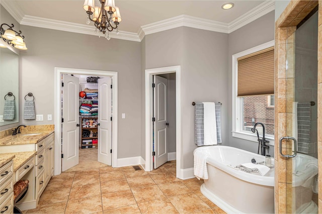 bathroom with tile patterned floors, a notable chandelier, ornamental molding, and vanity