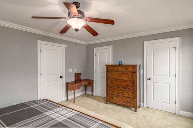 carpeted bedroom with ceiling fan and crown molding