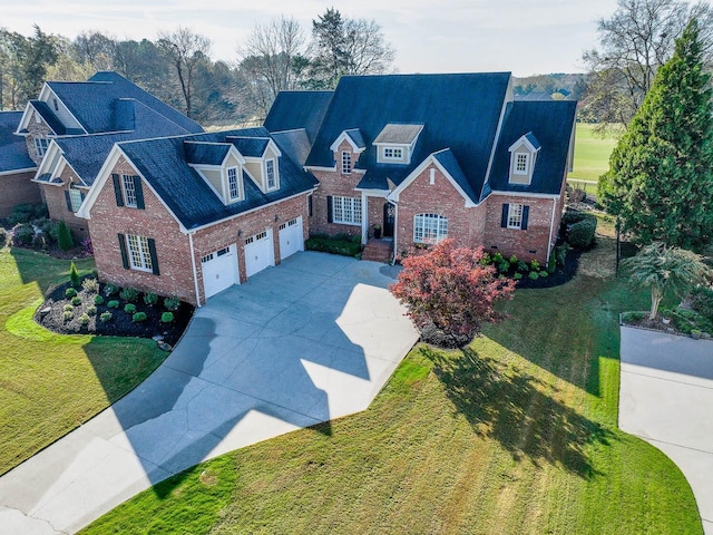 view of front of house featuring a garage and a front yard