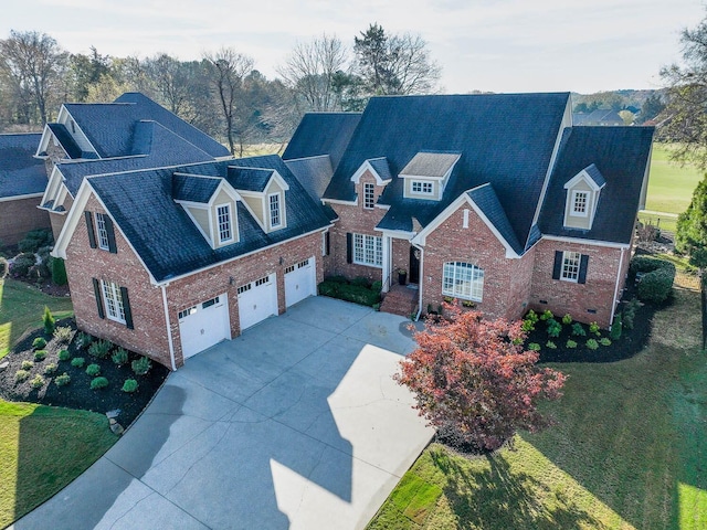 view of front of property featuring a front yard and a garage