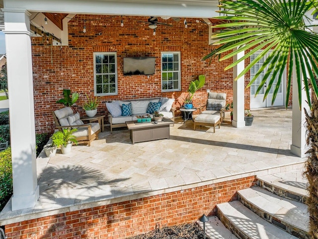 view of patio / terrace featuring an outdoor living space and ceiling fan