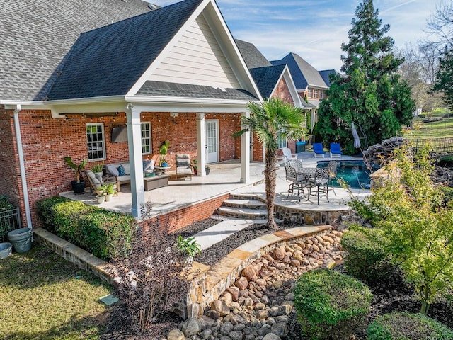 back of house featuring an outdoor hangout area and a patio