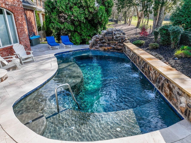 view of swimming pool featuring a patio area and pool water feature