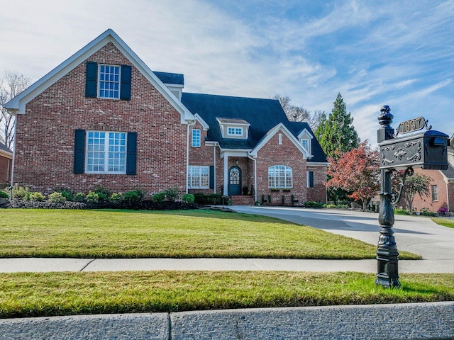 front facade with a front yard