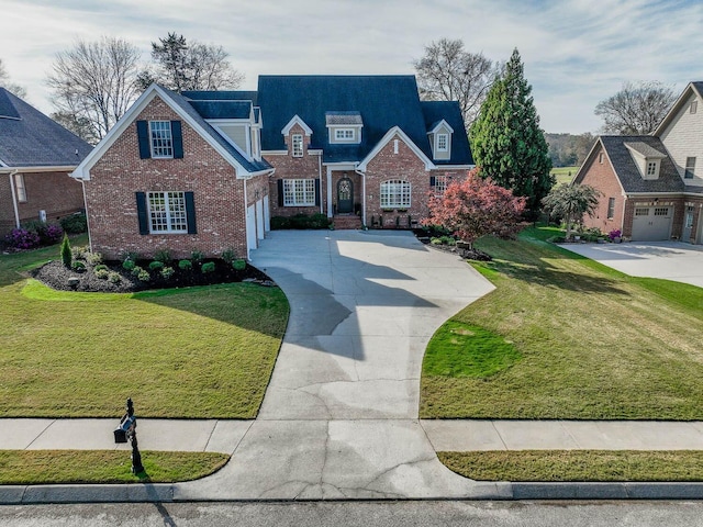 view of front of home featuring a garage and a front lawn