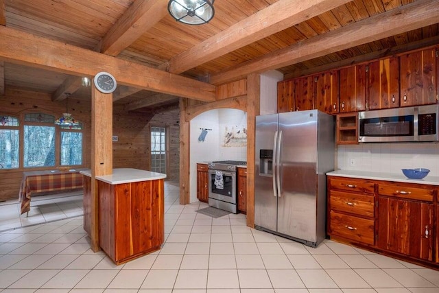 kitchen with backsplash, wood ceiling, stainless steel appliances, light tile patterned floors, and beamed ceiling