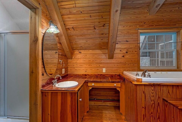 bathroom with vanity, wood walls, hardwood / wood-style flooring, vaulted ceiling with beams, and wood ceiling