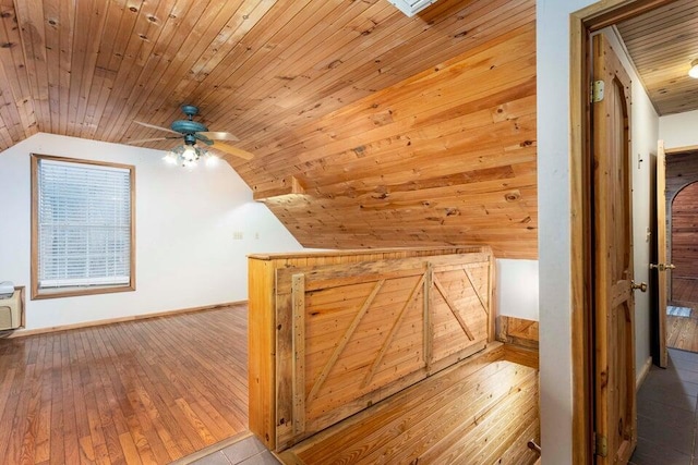 bonus room featuring light wood-type flooring, vaulted ceiling, ceiling fan, and wood ceiling