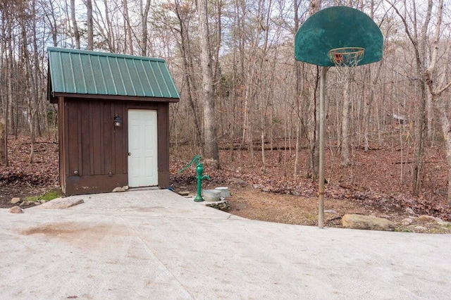 view of patio / terrace featuring a storage unit