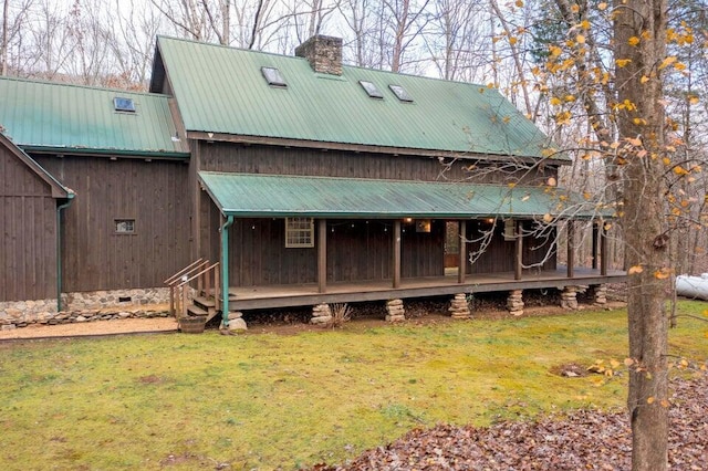 back of house with a yard