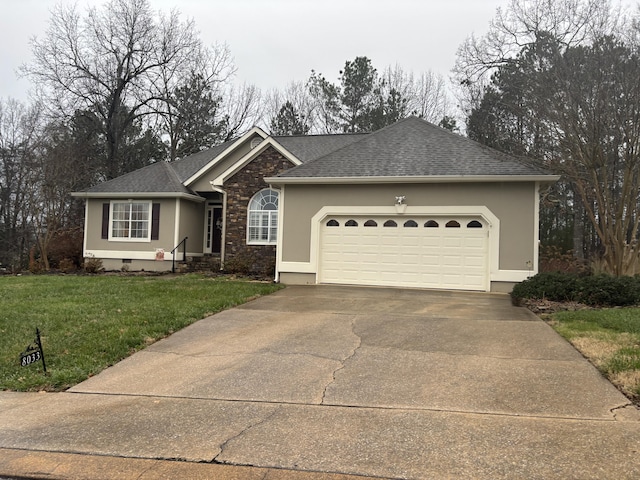 single story home featuring a front yard and a garage