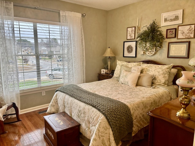 bedroom with wood-type flooring