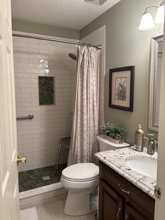 bathroom with vanity, a shower with curtain, a textured ceiling, and toilet