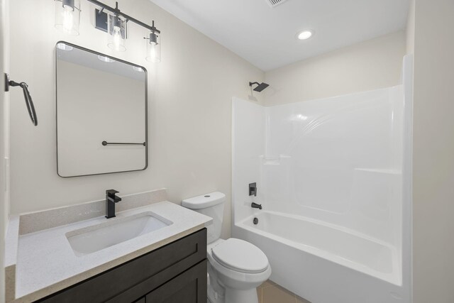 full bathroom with vanity, toilet, and shower / washtub combination