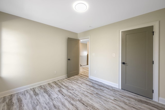 unfurnished bedroom featuring light hardwood / wood-style flooring